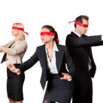 Three blindfolded people